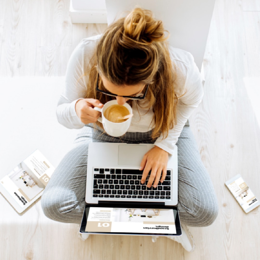 woman-on-floor-with-laptop-and-coffee