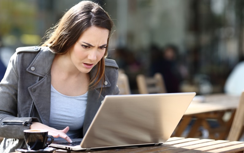frustrated woman on laptop upset about her website design