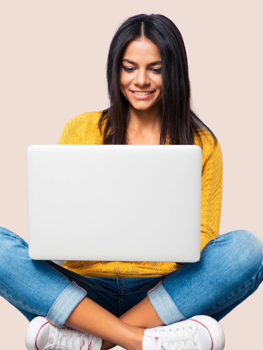woman sitting cross-legged with laptop