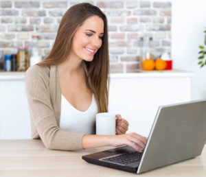 woman laptop coffee desk